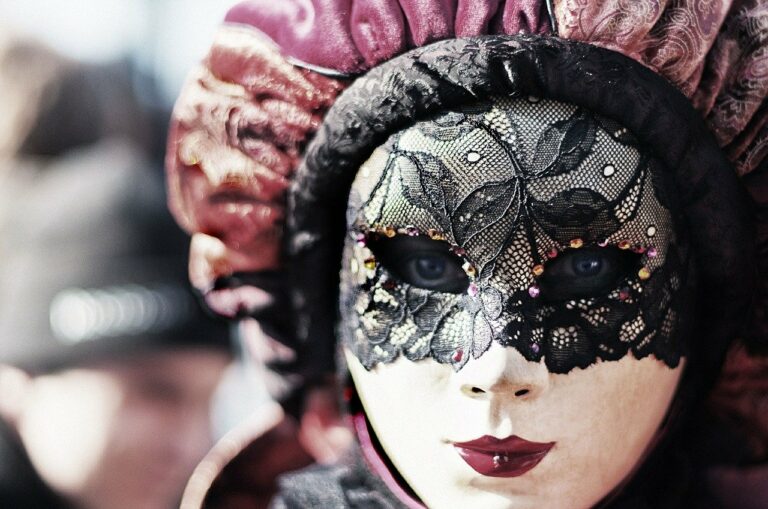 a close up of a person wearing a mask.