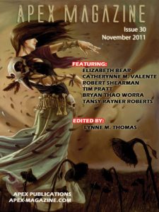 a magazine cover with a woman in a dress.