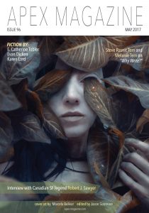 a magazine cover with a woman covered in leaves.