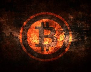 a bitcoin logo on a dark background.