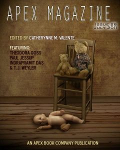 An Apex Magazine Issue 26 sitting on top of a wooden chair.