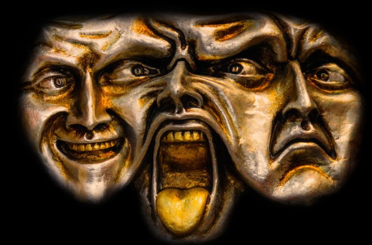 a painting of two faces with mouths open.