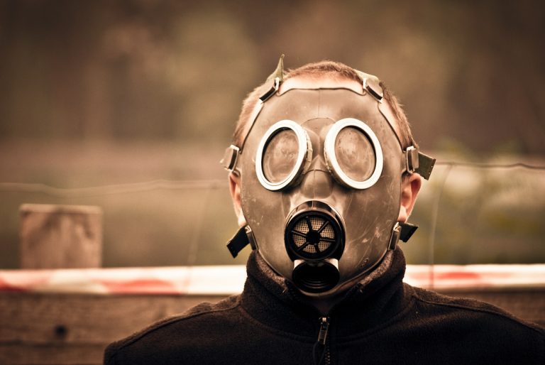 a man wearing a gas mask and goggles.