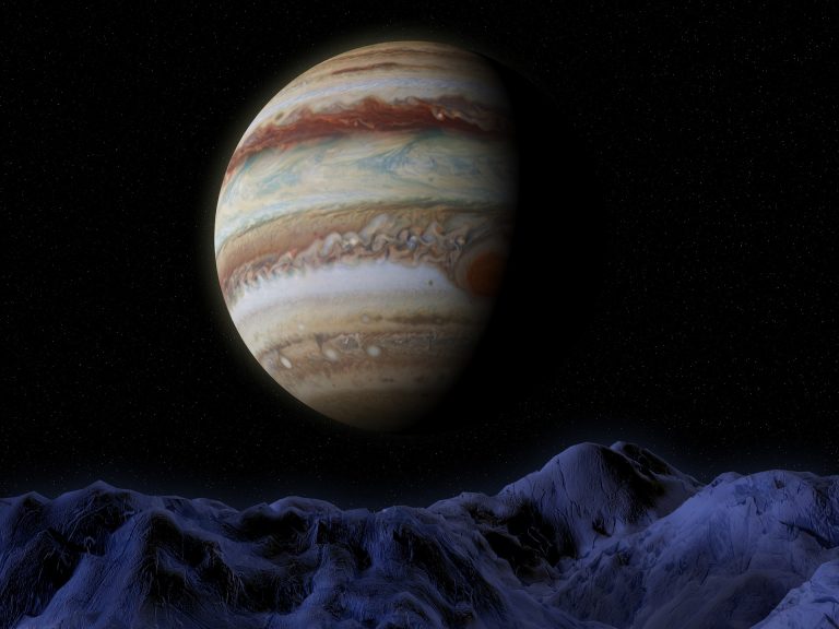 a very large planet in the middle of the night sky.