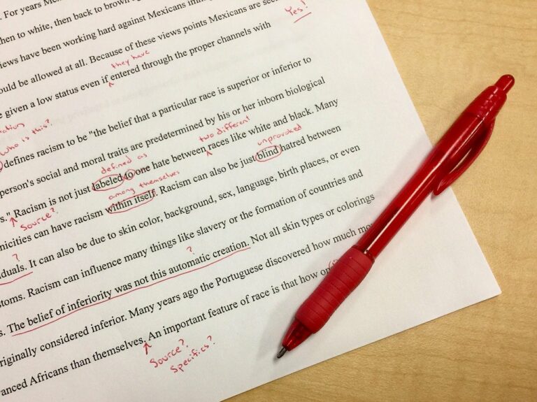 a pen sitting on top of a piece of paper.