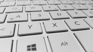 a close up of a computer keyboard with letters on it.