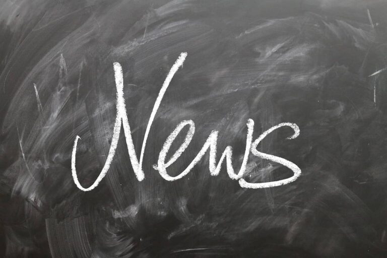 a chalkboard with the word news written on it.