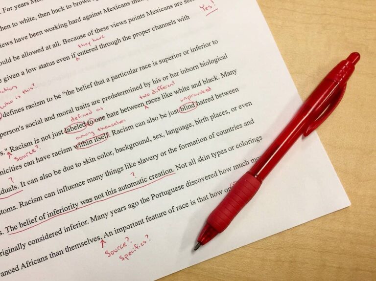 a pen sitting on top of a piece of paper.