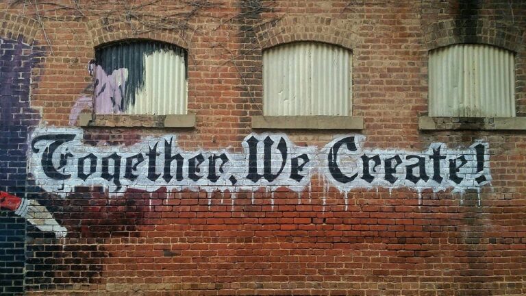 a brick building with graffiti on the side of it.