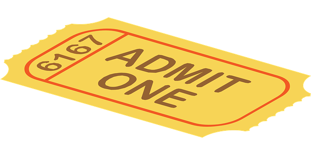 a yellow admit ticket with the word admit one on it.